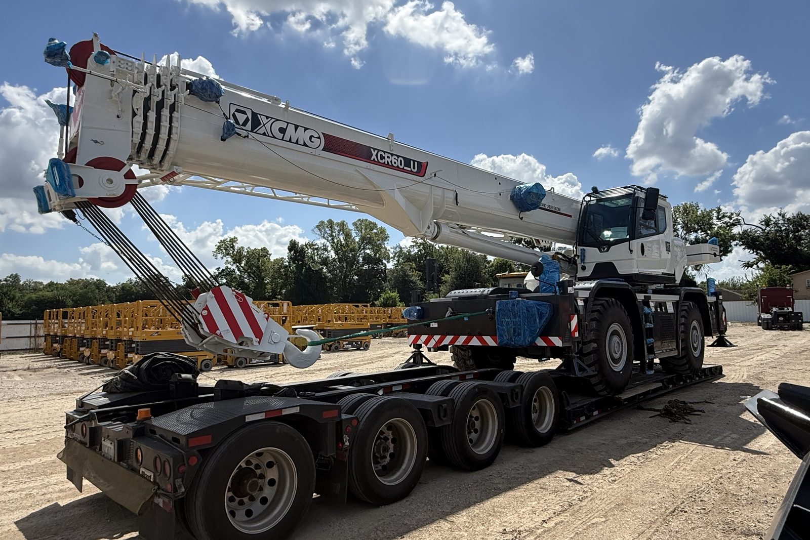 XCMG XCR60_U rough terrain crane loaded on a multi-axle lowboy trailer